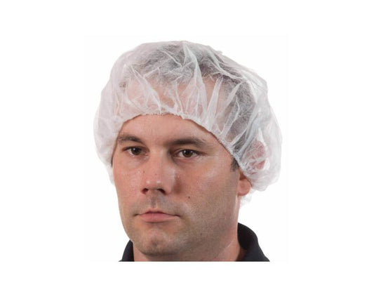 Man wearing a clear plastic hairnet on a white background