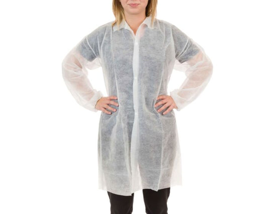 Person wearing a white disposable lab coat on a white background