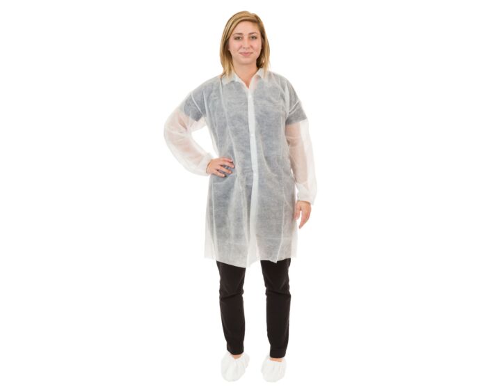Person wearing a white disposable lab coat on a white background