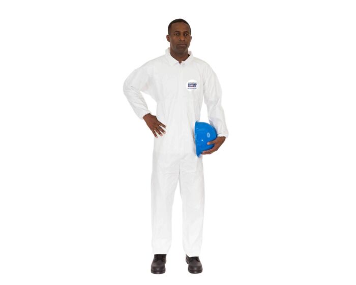 Person wearing a white coverall holding a blue hard hat on a white background