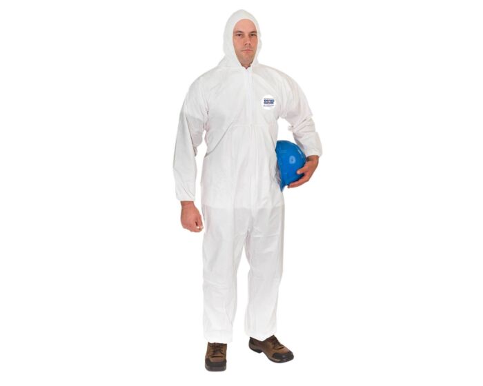Person wearing a white protective coverall holding a blue hard hat on a white background