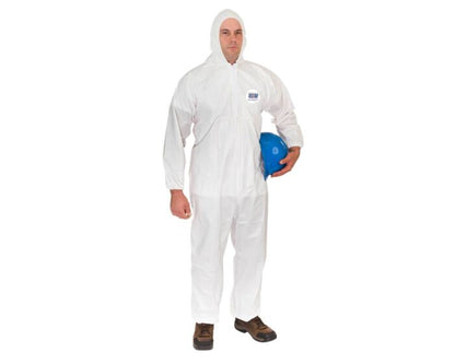Person wearing a white protective coverall holding a blue hard hat on a white background