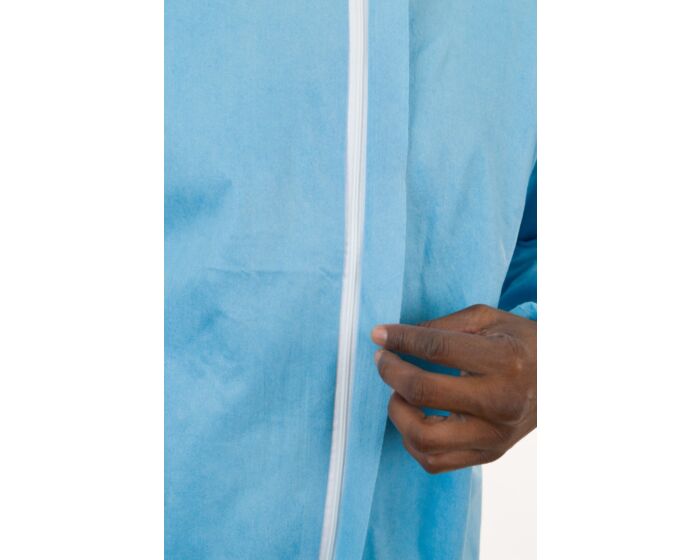 Person holding a blue curtain with a white rod