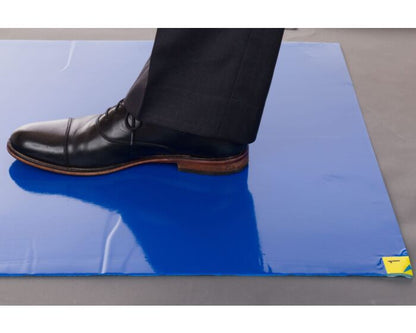 Person stepping on Enviromat blue adhesive tacky mat - removes dirt from shoes at cleanroom entry
