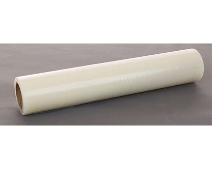 Roll of white paper on a gray surface