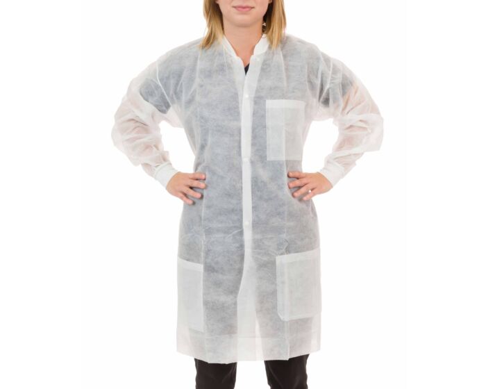Person wearing a white disposable lab coat on a white background