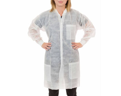 Person wearing a white disposable lab coat on a white background