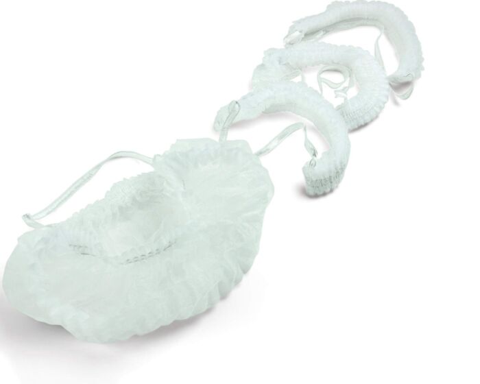 Light blue bath pouf with a hook on a white background