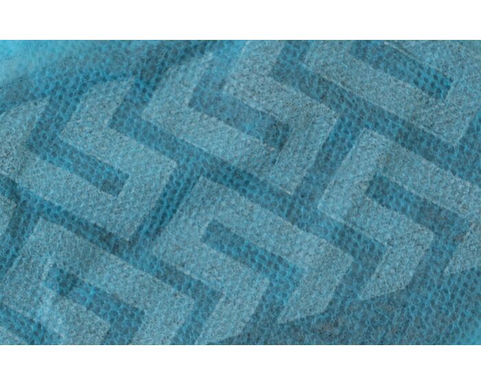 Close-up of a textured blue fabric with a geometric pattern