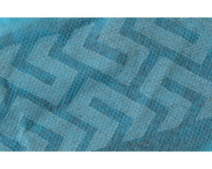 Close-up of a textured blue fabric with a geometric pattern